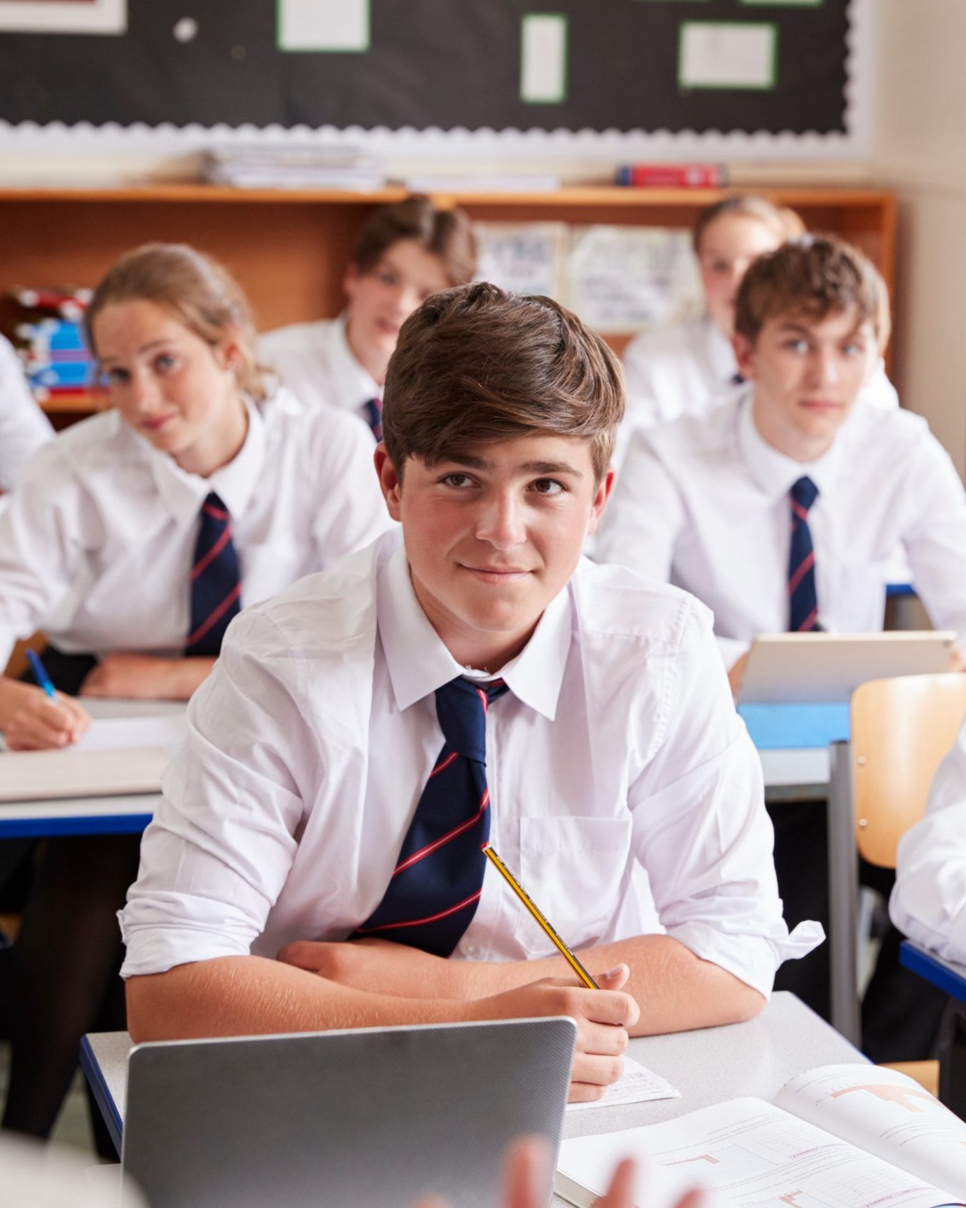 Students Listening to Teacher In Classroom